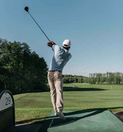 back-view-of-stylish-man-playing-golf-alone-at-gol-RQ9P6GV.jpg