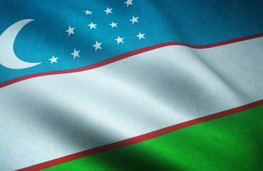 Closeup shot of the realistic flag of Uzbekistan with interesting textures