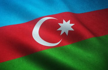 Closeup shot of the waving flag of Azerbaijan with interesting textures