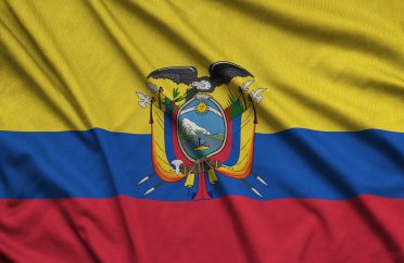 Ecuador flag is depicted on a sports cloth fabric with many folds. Sport team waving banner